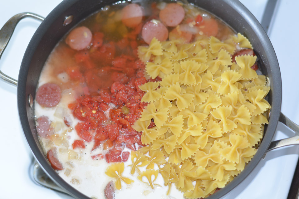 sausage, pasta, diced tomatoes in large skillet