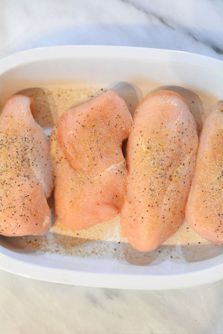 chicken breasts in a casserole dish