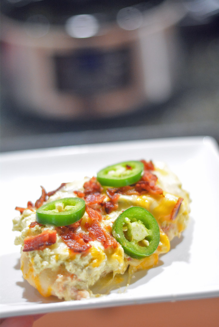 Chicken topped with cream cheese, bacon and jalapeno