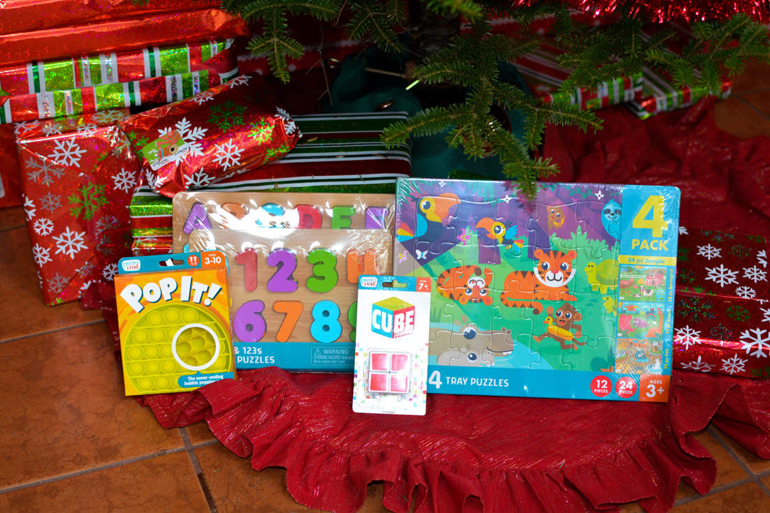 chuckle & roar puzzles under christmas tree