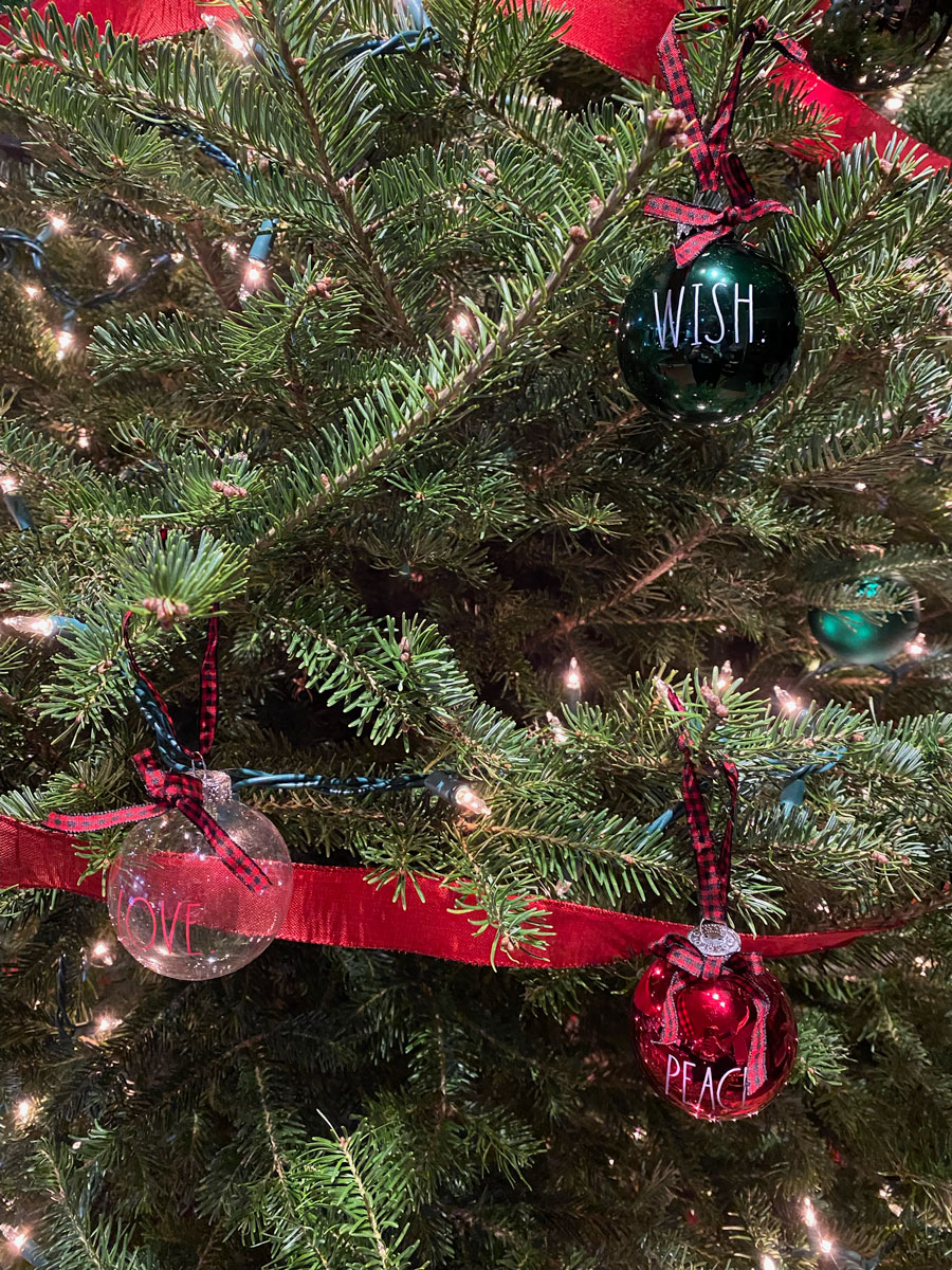 Rae Dun Red, Green, and Clear Glass Ornaments on tree
