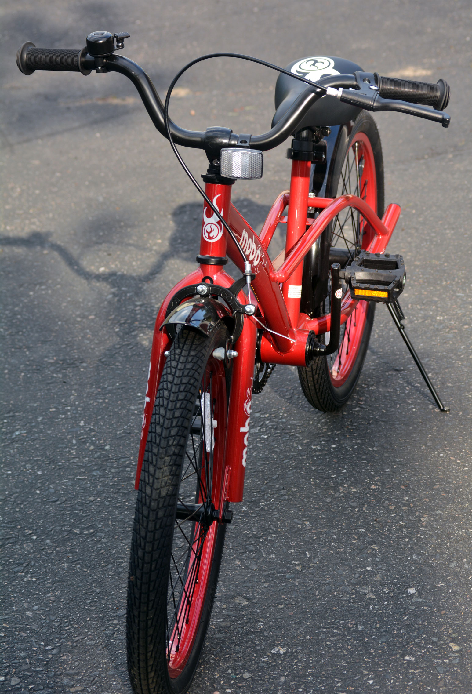 bicycle with kickstand in driveway