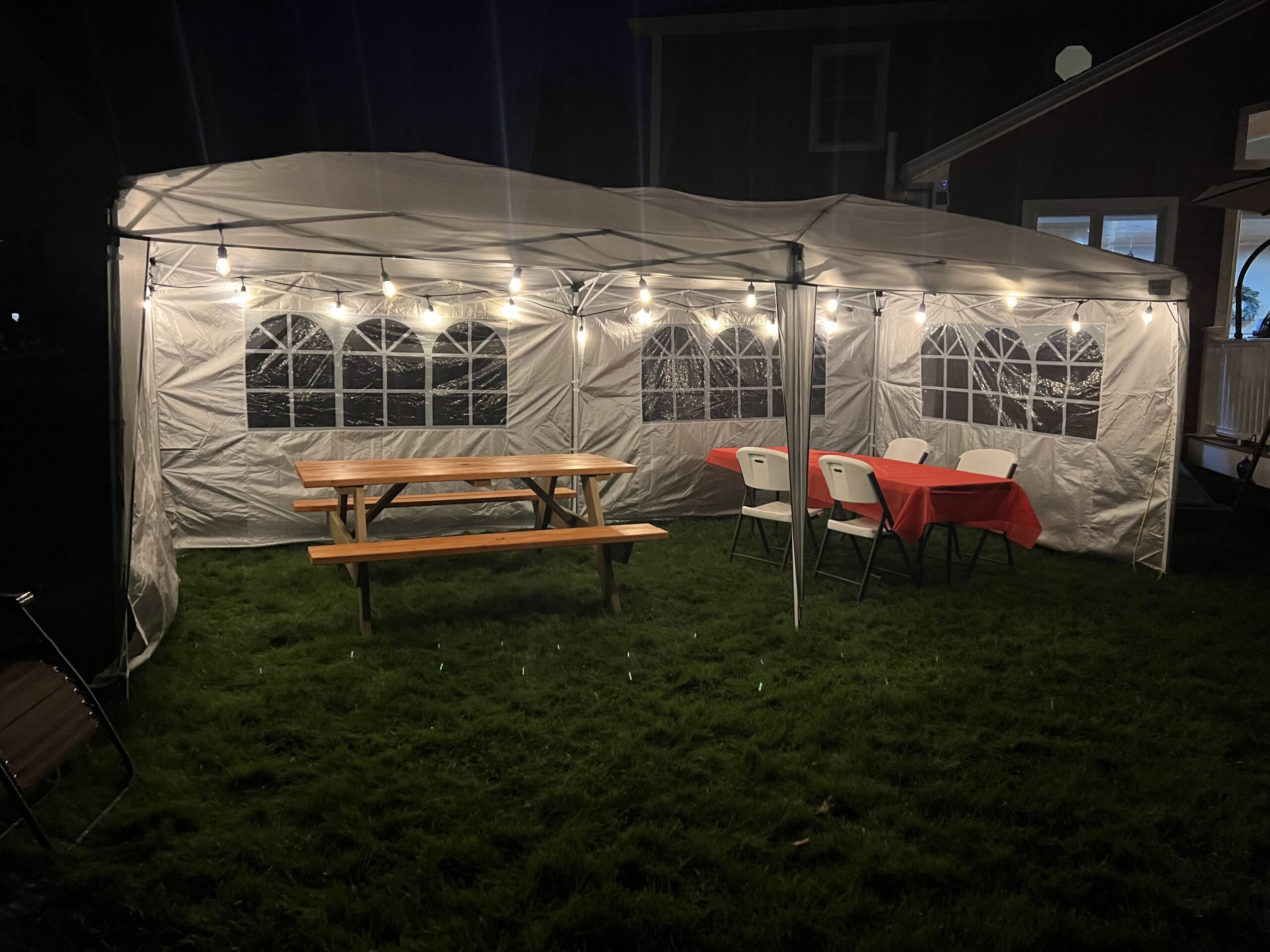 quictent 10x20 party tent at night with lights